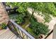Cozy backyard garden with greenery, a white picket fence and a brick walkway at 1508 Brianwood Rd # 1508, Decatur, GA 30033