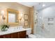 Bathroom with stylish vanity and marble shower with gold fixtures and glass door at 1508 Brianwood Rd # 1508, Decatur, GA 30033
