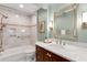 Bathroom with marble countertop, under-mount sink and tile bath and shower at 1508 Brianwood Rd # 1508, Decatur, GA 30033