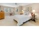 Bedroom with a window, ceiling fan, side tables with lamps, and an easy chair at 1508 Brianwood Rd # 1508, Decatur, GA 30033