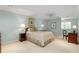 Spacious bedroom featuring neutral walls, carpet floors, and two side tables with lamps at 1508 Brianwood Rd # 1508, Decatur, GA 30033