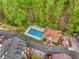 Aerial view of a community pool surrounded by mature trees and a sun deck at 1508 Brianwood Rd # 1508, Decatur, GA 30033