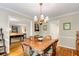 Elegant dining area with hardwood floors, chandelier lighting, and seamless flow into adjacent rooms at 1508 Brianwood Rd # 1508, Decatur, GA 30033
