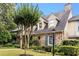 A view of the front exterior angle with manicured lawn and attractive landscaping at 1508 Brianwood Rd # 1508, Decatur, GA 30033