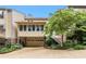Multi-level home exterior with a covered patio, garage, and backyard greenery at 1508 Brianwood Rd # 1508, Decatur, GA 30033