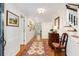 Long foyer with hardwood floors, a decorative rug, and a staircase at 1508 Brianwood Rd # 1508, Decatur, GA 30033