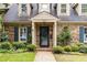 Inviting front entrance of a brick home with a classic door, trim, and manicured landscaping at 1508 Brianwood Rd # 1508, Decatur, GA 30033