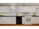 Bright kitchen featuring white cabinets, dark countertops, subway tile backsplash, and modern appliances at 1508 Brianwood Rd # 1508, Decatur, GA 30033