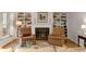 Cozy living room with a fireplace, built-in bookshelves, and plush seating at 1508 Brianwood Rd # 1508, Decatur, GA 30033