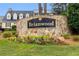 Stone entrance sign for Brianwood community featuring colorful flowerbeds at 1508 Brianwood Rd # 1508, Decatur, GA 30033