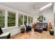 Bright sunroom with tile floors, ceiling fan and plenty of natural light at 1508 Brianwood Rd # 1508, Decatur, GA 30033