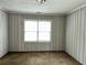 Bedroom featuring neutral-striped wallpaper and a well-lit window at 1846 North Ave, Atlanta, GA 30318