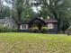 Charming one-story home with a freshly painted exterior, a well-manicured lawn, and mature trees at 1846 North Ave, Atlanta, GA 30318