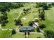A scenic aerial shot of a golf course clubhouse provides stunning views of the meticulously manicured landscape at 229 Devonwood Dr, Atlanta, GA 30328