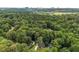 An aerial perspective shows a house surrounded by lush greenery, creating a peaceful and private setting at 229 Devonwood Dr, Atlanta, GA 30328