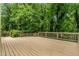 An expansive backyard deck offers generous outdoor space for lounging and activities surrounded by nature's beauty at 229 Devonwood Dr, Atlanta, GA 30328