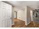 Spacious basement with vinyl flooring and access to the utility room at 229 Devonwood Dr, Atlanta, GA 30328