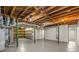 Unfinished basement with high ceilings, painted walls, and utility connections at 229 Devonwood Dr, Atlanta, GA 30328