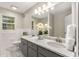Bright bathroom featuring double sinks, marble countertops, and modern fixtures at 229 Devonwood Dr, Atlanta, GA 30328