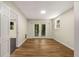 Neutral bedroom with wood floors and double doors to the backyard at 229 Devonwood Dr, Atlanta, GA 30328
