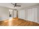A light-filled bedroom with hardwood floors and neutral decor at 229 Devonwood Dr, Atlanta, GA 30328