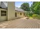A spacious wooden deck offers an outdoor space for relaxation and entertainment, connecting to the home's exterior at 229 Devonwood Dr, Atlanta, GA 30328