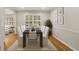 Elegant dining room with seating for eight and views of the backyard at 229 Devonwood Dr, Atlanta, GA 30328