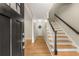 Entryway featuring hardwood floors, stairs, and a welcoming wreath on the door at 229 Devonwood Dr, Atlanta, GA 30328