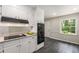 Bright kitchen with white cabinets, stainless steel appliances, and granite countertops at 229 Devonwood Dr, Atlanta, GA 30328