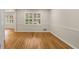 Bright room with hardwood floors, and views to connecting rooms and windows at 229 Devonwood Dr, Atlanta, GA 30328