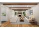 Bright living room with hardwood floors, fireplace, and exposed wood beams at 229 Devonwood Dr, Atlanta, GA 30328