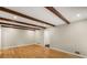 Large living room with hardwood floors, exposed beam ceiling, and neutral paint at 229 Devonwood Dr, Atlanta, GA 30328