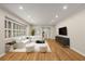 Bright living room with hardwood floors, plantation shutters, recessed lighting, and neutral decor offers a cozy and inviting space at 229 Devonwood Dr, Atlanta, GA 30328