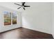 Inviting bedroom space with natural light and wood-look flooring at 2539 Larson Creek Cv, Duluth, GA 30097
