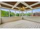Relaxing screened-in porch with decorative ceiling and view of the lush backyard at 2539 Larson Creek Cv, Duluth, GA 30097
