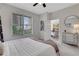 Bright bedroom with city views, soft carpet, and stylish furniture at 1101 Juniper Ne St # 619, Atlanta, GA 30309