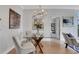 Elegant dining area with modern chandelier, glass table and seating for four at 1101 Juniper Ne St # 619, Atlanta, GA 30309