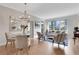 Bright living room with dining area, city views from the window, and stylish modern decor at 1101 Juniper Ne St # 619, Atlanta, GA 30309