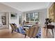 Bright living room with hardwood floors, stylish furniture, and a large window overlooking the city at 1101 Juniper Ne St # 619, Atlanta, GA 30309