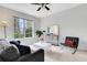 The neutral living room features a contemporary design and large windows offering city views at 1101 Juniper Ne St # 619, Atlanta, GA 30309