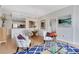 Open-concept living and dining area with hardwood floors, stylish chairs, and a view into the kitchen at 1101 Juniper Ne St # 619, Atlanta, GA 30309