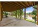 Spacious back patio with a beautiful view of the lake and a seating area at 132 Lakeshore Dr, Roswell, GA 30075