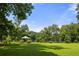 Expansive backyard with lush lawn and a charming gazebo offering serene views at 132 Lakeshore Dr, Roswell, GA 30075