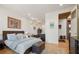 Spacious bedroom with views, wood floors, and ensuite bath access at 132 Lakeshore Dr, Roswell, GA 30075