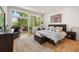 Bright bedroom with large windows, a deck, and hardwood floors at 132 Lakeshore Dr, Roswell, GA 30075