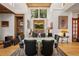 Elegant dining room with ample lighting, stylish decor, and rustic wooden accents at 132 Lakeshore Dr, Roswell, GA 30075