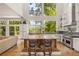 Gourmet kitchen boasts a large island, stainless steel appliances, and scenic outdoor views at 132 Lakeshore Dr, Roswell, GA 30075