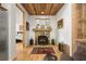 Cozy living room with a stone fireplace, wood ceiling, and rustic accents at 132 Lakeshore Dr, Roswell, GA 30075