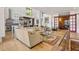 Open-concept living area with kitchen, dining area, hardwood floors and natural light at 132 Lakeshore Dr, Roswell, GA 30075