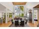 Open-concept living space with high ceilings, large windows, and an adjacent dining area at 132 Lakeshore Dr, Roswell, GA 30075
